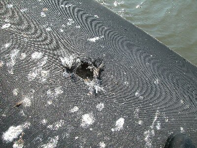 Intentional cut in the geotextile breakwater 