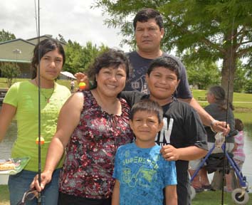family with fishing poles