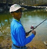 Urban Teenager Tries Fishing at Mary Jo Peckham Park in Katy Near Houston