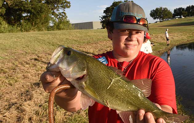 Boy catches a bass
