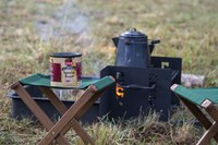 campfire and coffee set up at a campsite