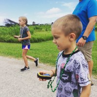 kids with gps units looking for geocache in scenic park