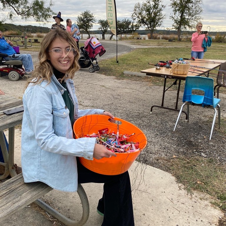 Volunteer passing out candy