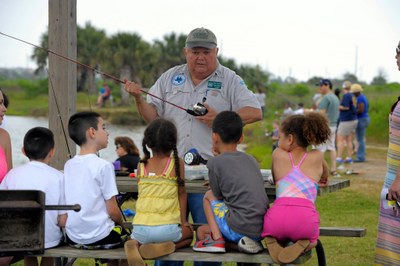 Oscar M teaching at Galveston Go Fish event.jpg