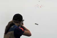 student shooter aiming at clays