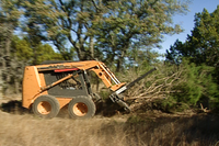 Clearing brush with bulldozer