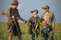 Adult with young dove hunters