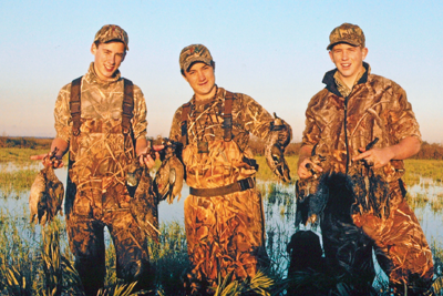Young hunters with harvested waterfowl