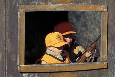 Youth hunter in blind