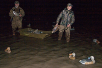 Hunters setting out decoys in pre-dawn hours