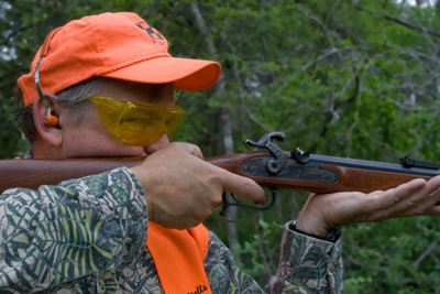 shooter firing muzzleloader