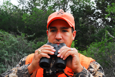 hunter lowers binoculars