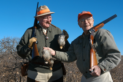 hunters with game birds