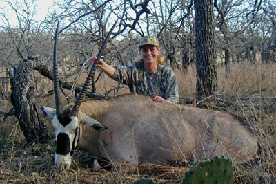 Hunter poses with exotic harvest 