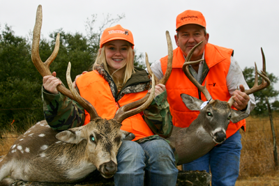 mom and daughters with harvested deer
