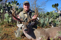 Hunter posing with harvested buck
