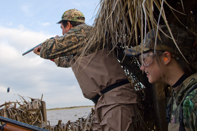 Hunter shooting from inside box blind