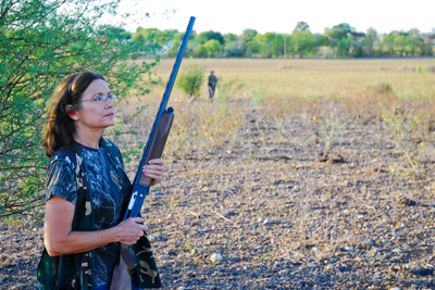 hunter posting at edge of field