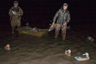 Hunters setting out decoys in pre-dawn hours