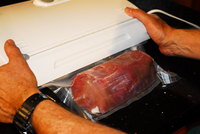 Vacuum sealing processed meat for storage