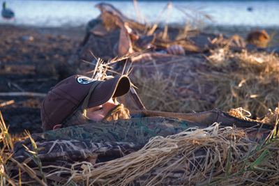 Hunters face exposed in layout blind