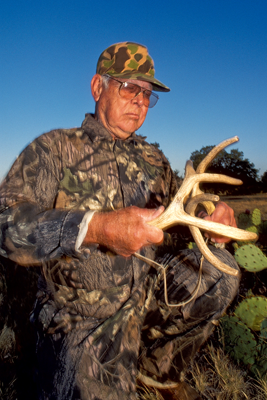 Hunter rattling antlers