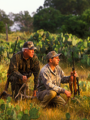 hunters kneeling and watching