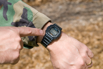 wristwatch on hunters arm
