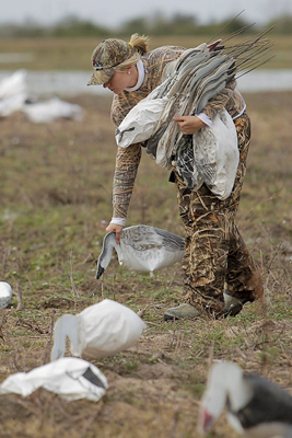 Hunter picking up rag decoys