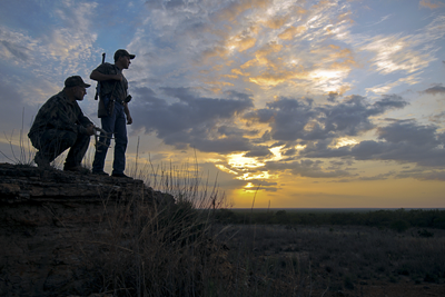 Hunters at sunset
