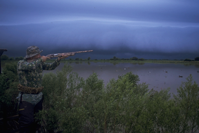 Storm rolling in on waterfowl hunter