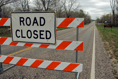 Road Closed sign at flooded road