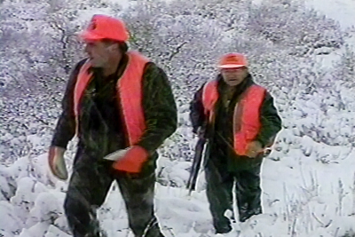 Hunters walking in the snow