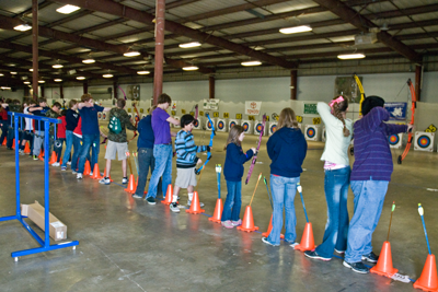 students practicing on archery targets