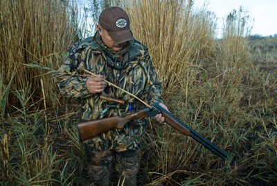 hunter clearing obstruction from gun barrel