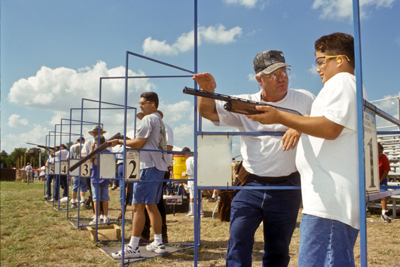 Youth shotgun shooting practice with instructor