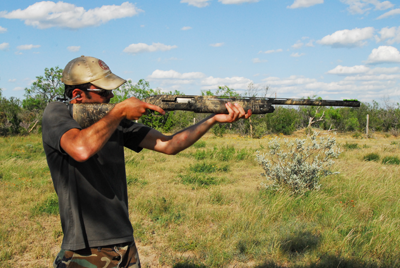 Shooter taking aim with shotgun