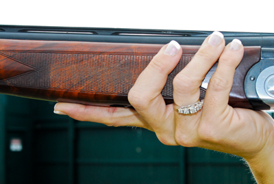 pointing index finger supporting shotgun