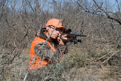 kneeling shooter aiming rifle