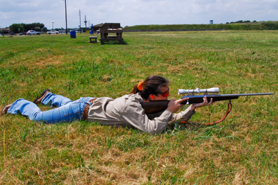 prone shooter aiming rifle