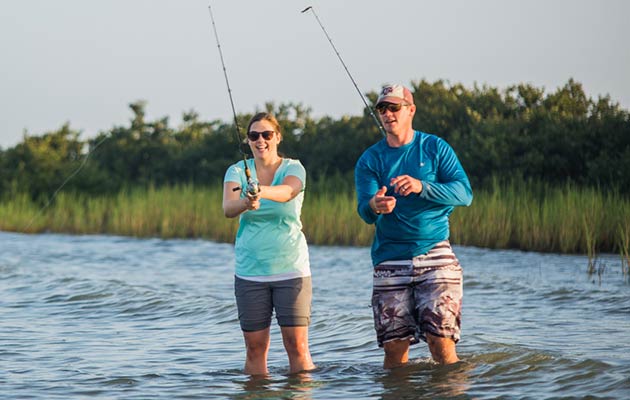 Couple fishing in water