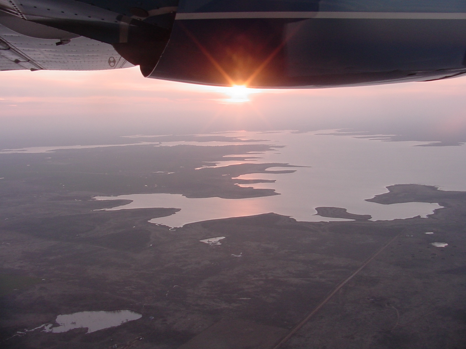 Survey plane over Texas lakes.