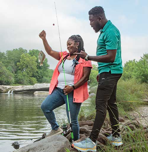 Couple fishing in McKinney Falls State Park