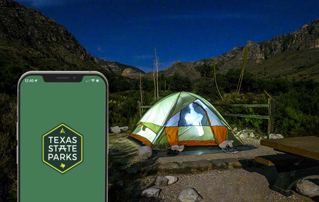 Texas State Parks app and tent under Texas sky