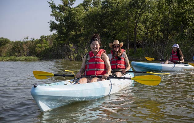 young ladies kayaking on Lake Mineral Wells