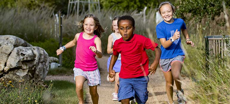 Kids racing down a trail