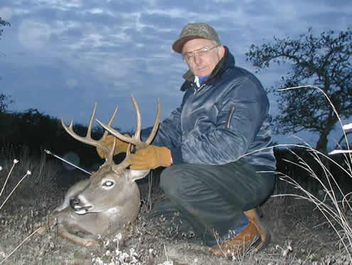 Hunter With Harvested Whitetail Buck
