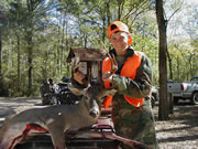 Youth hunter with harvested buck deer