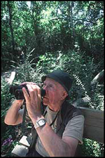 Image of a birdwatching man with binoculars