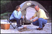 Couple camping, one of the many activities that can be enjoyed as a nature tourist.